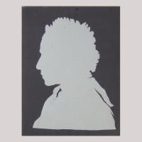 Life size silhouette of a woman with scarf facing left