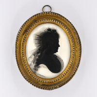 Front of Silhouette, in frame, with woman looking right 