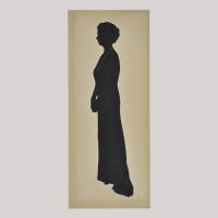 Silhouette of a woman in dress looking left