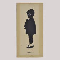Silhouette of a girl with puppet looking left