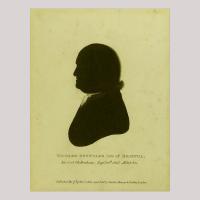 Silhouette of a man facing left