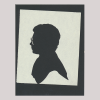 Front of silhouette, with woman looking left, wearing glasses.