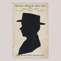 Front of silhouette, with man looking left, wearing a hat, with inscriptions.