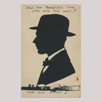 Front of silhouette, with man looking left, in suit and wearing a hat, some hand-written inscriptions in top and bottom.
