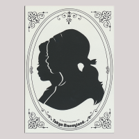 Front of silhouette, with two kids overlapping looking left, in rounded frame, in coreners decorations, inscription in bottom with, Tokyo Disneyland.