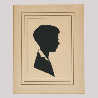 Front of silhouette, with boy looking right, in a squared frame.