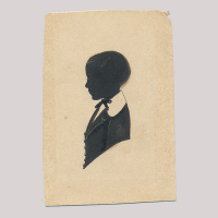 Front of silhouette, with boy looking left.