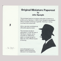 Front of silhouette, with man looking left, wearing a hat and smoking a sigarette. Long inscription starting, Original Miniature Papercut by John Speight...