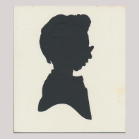 Front of silhouette, with boy looking right, wearing glasses.