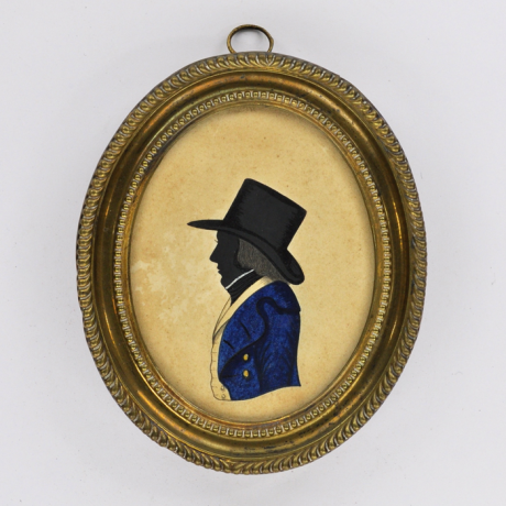 
        Front of silhouette, in frame, with man looking left, with a hat, wearing blue and yellow jacket.
