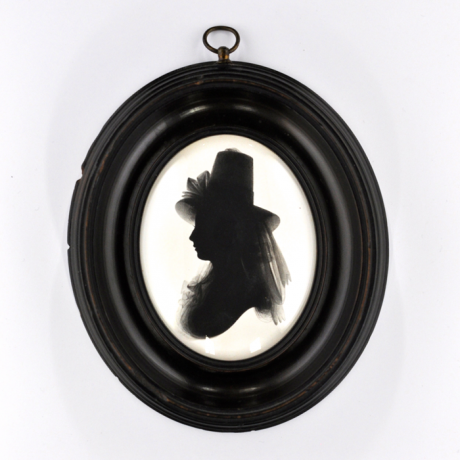 
        Front of silhouette, in frame, with woman looking left, with a hat with ribbon.