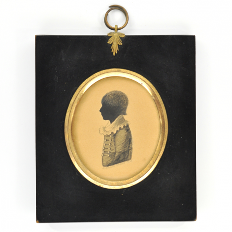 
        Front of silhouette, in frame, with boy looking left.