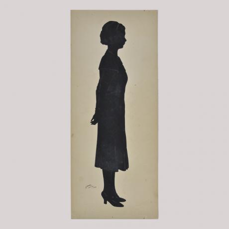 
        Silhouette of a woman in dress looking right