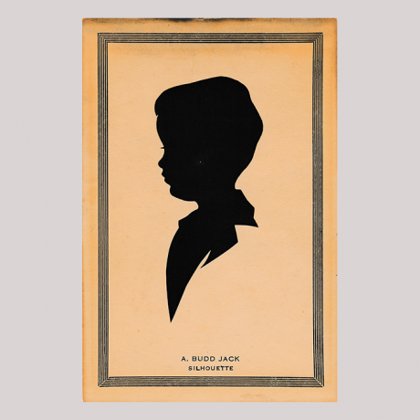 
        Front of silhouette, in painted square frame, with boy looking left.