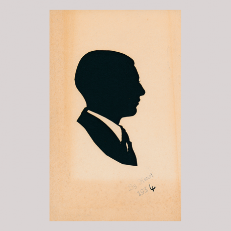 
        Front of silhouette, man looking right, wearing a suit.