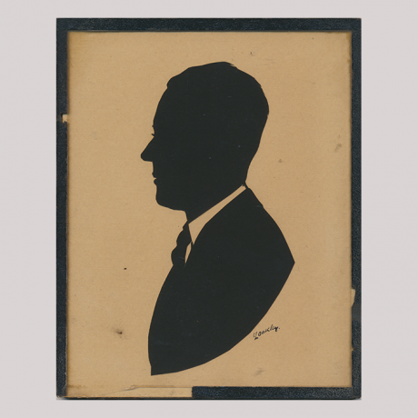 
        Front of silhouette, Man with a white collar looking to the left