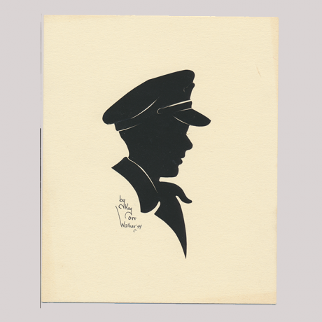 
        Front of silhouette, Man in uniform looking to the right