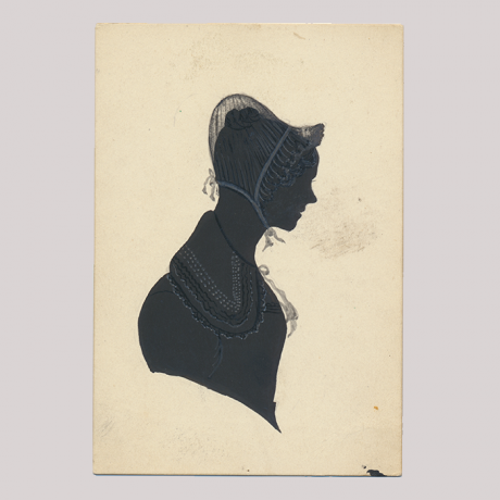 
        Front of silhouette, with woman looking right, wearing a bonnet.