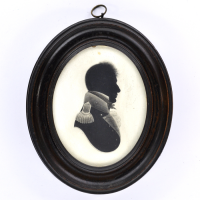 Front of Silhouette, in frame, with man looking right and wearing naval uniform