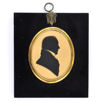 Front of silhouette, in frame, with man looking right, wearing a stock.