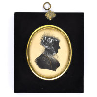 Front of Silhouette, in frame, with woman looking right and wearing a bonnet decorated with ribbons