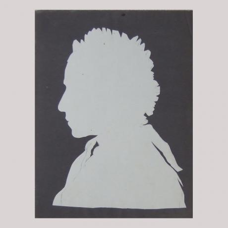 
        Life size silhouette of a woman with scarf facing left