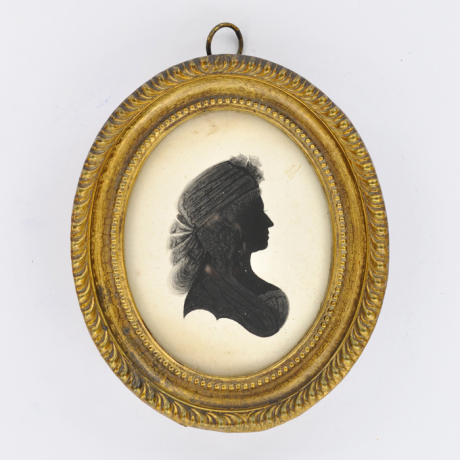 
        Front of Silhouette, in frame, with woman looking right.