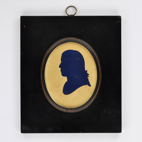 
        Front of silhouette, in frame, with man looking left.