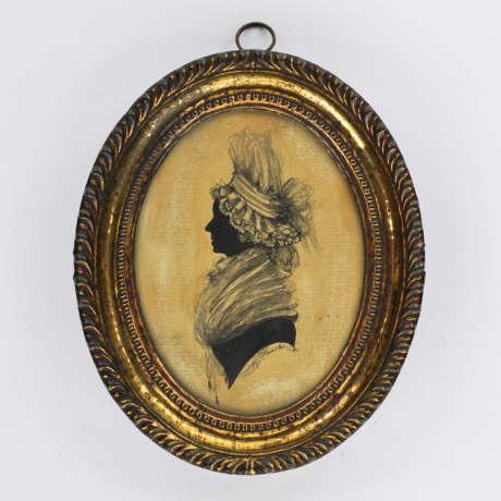 
        Front of Silhouette, in frame, with woman looking left and wearing a hat