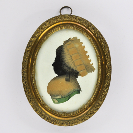 
        Front of silhouette, in frame, woman looking left, weraing a hat.