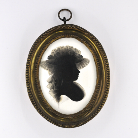 
        Front of silhouette, in frame, with woman looking right, with a hat with ribbon.