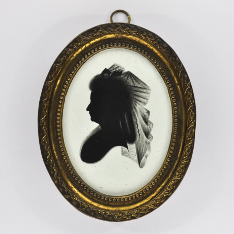 
        Front of Silhouette, in frame, with woman looking right and wearing a ribbon