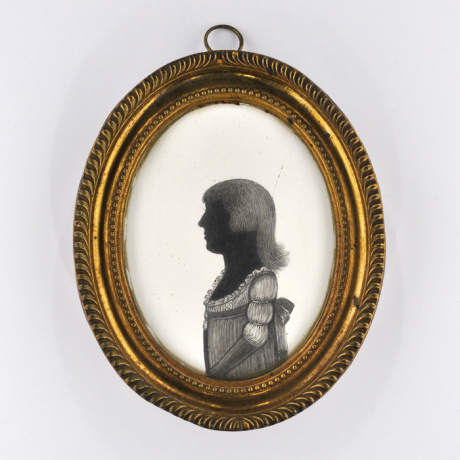 
        Front of silhouette, in frame, with young girl looking left.