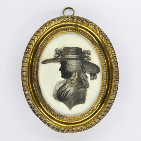 
        Front of silhouette, in frame, with woman looking left, wearing a plumed hat.