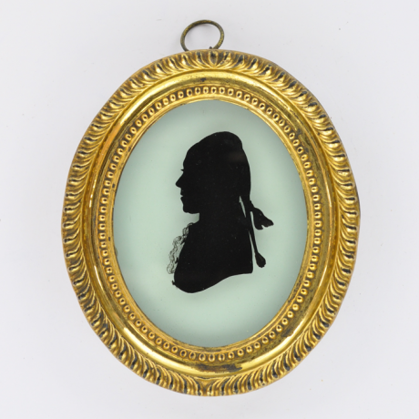 
        Front of silhouette, in frame, with man looking left.