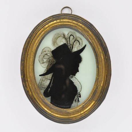 
        Front of Silhouette, in frame, with woman looking right and wearing a hat decorated with ribbons and plumes