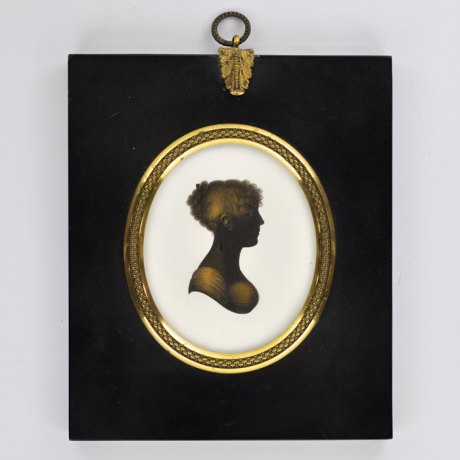 
        Front of silhouette, in frame, with a woman looking right.