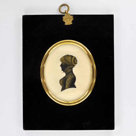 
        Front of shilouette, in frame, with woman looking left.