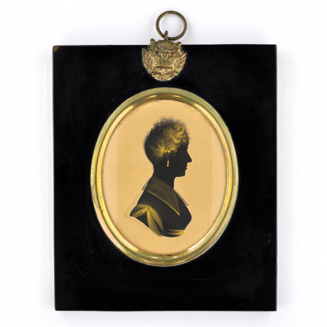 
        Front of silhouette, in frame, with woman looking right.