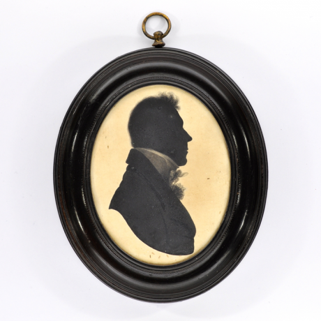 
        Front of silhouette, in frame, with man looking right.