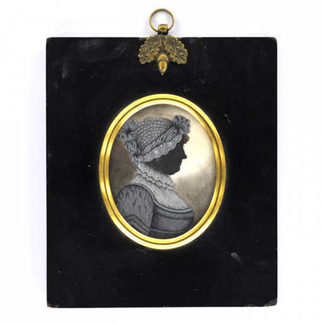 Front of silhouette, in frame, with woman looking right, wearing a bonnet.
