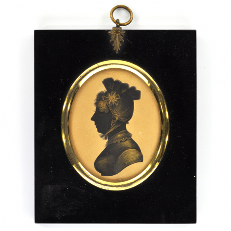 
        Front of silhouette, in frame, wearing a bannet.