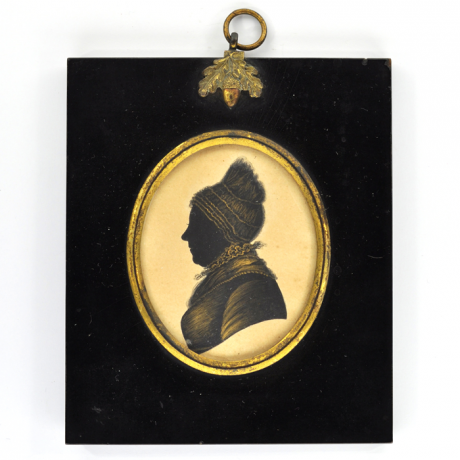 Front of Silhouette, in frame, with woman looking and wearing a bonnet