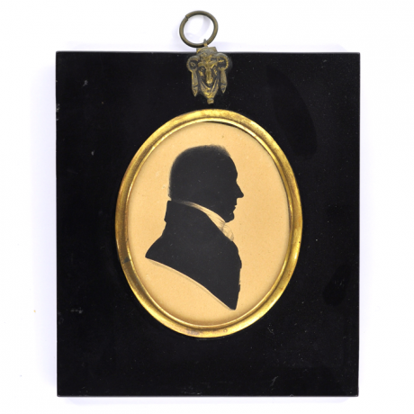 
        Front of silhouette, in frame, with man looking right, wearing a stock.