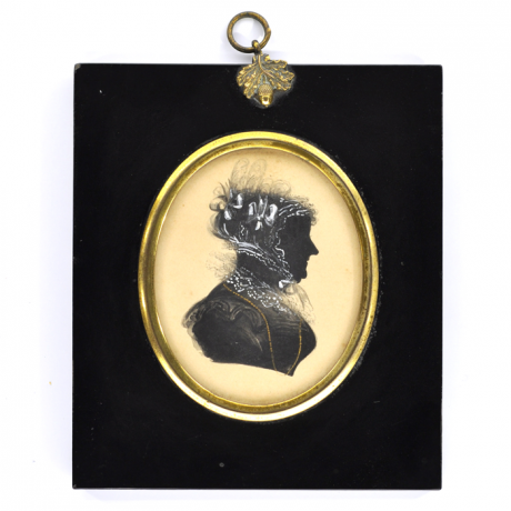 
        Front of Silhouette, in frame, with woman looking right and wearing a bonnet decorated with ribbons