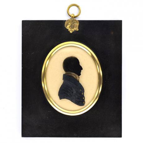 
        Front of silhouette, in frame, with man looking right, wearing a stock.