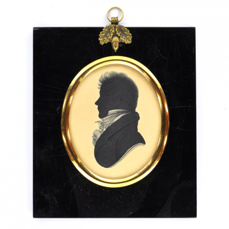 
        Front of silhouette, in frame, with man looking left, wearing a stock.