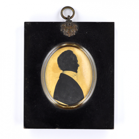 
        Front of silhouette, in frame, with man looking right, wearing a high necked collar.