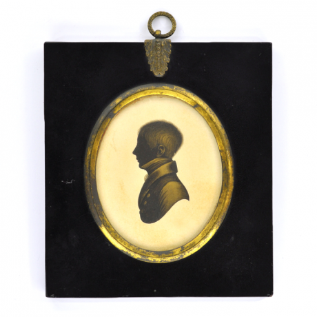 
        Front of silhouette, in frame, with boy looking left, wearing a high necked collar.