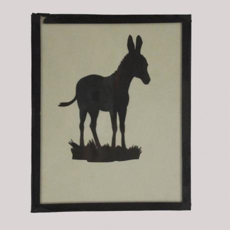 
        Silhouette of a donkey looking right